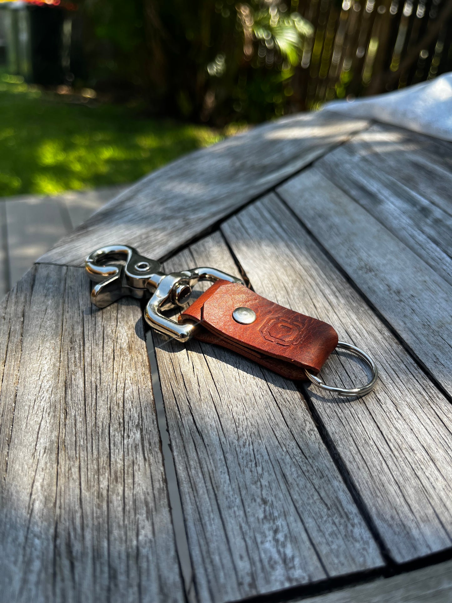 Keychain with keys attached to a wooden surface